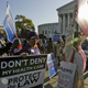Health care law supporters outside the Supreme Court (Enlarge Charles Dharapak/AP)